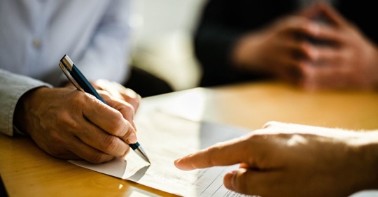 Signing insurance paperwork